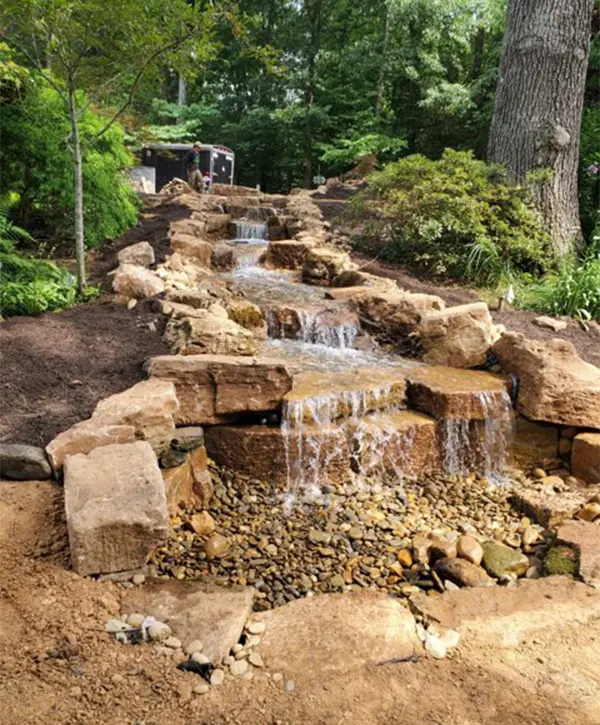 Pondless waterfall with yellow rocks and dirt